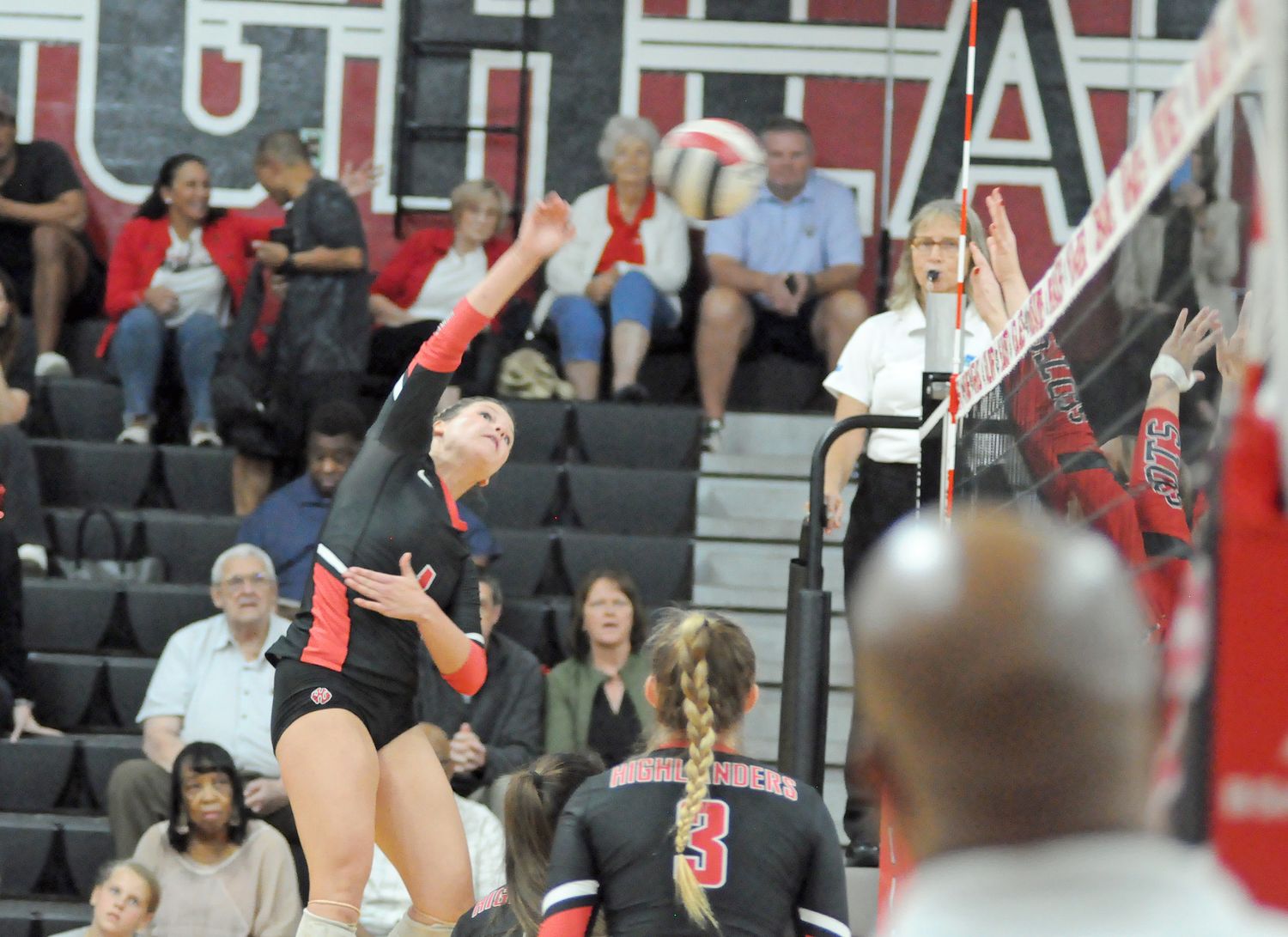 Lake Highland Prep outside hitter Kayden Green goes for one of her eight kills against Boca Raton St. Andrew's. Green also had 10 digs to help the Highlanders win 25-8, 25-15, 25-21 in the Region 2-3A volleyball final.